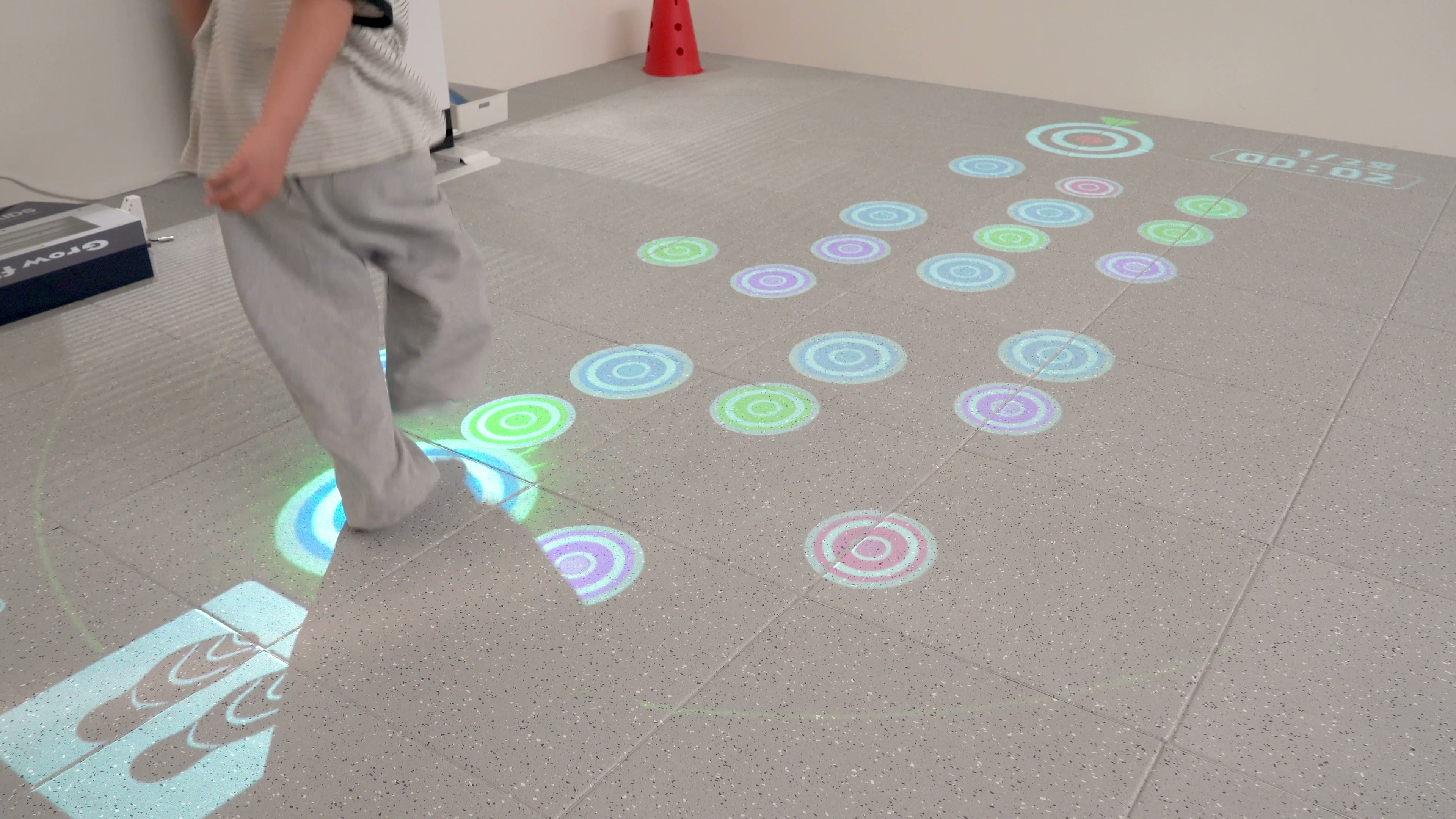 Child taking part in a projected floor movement activity