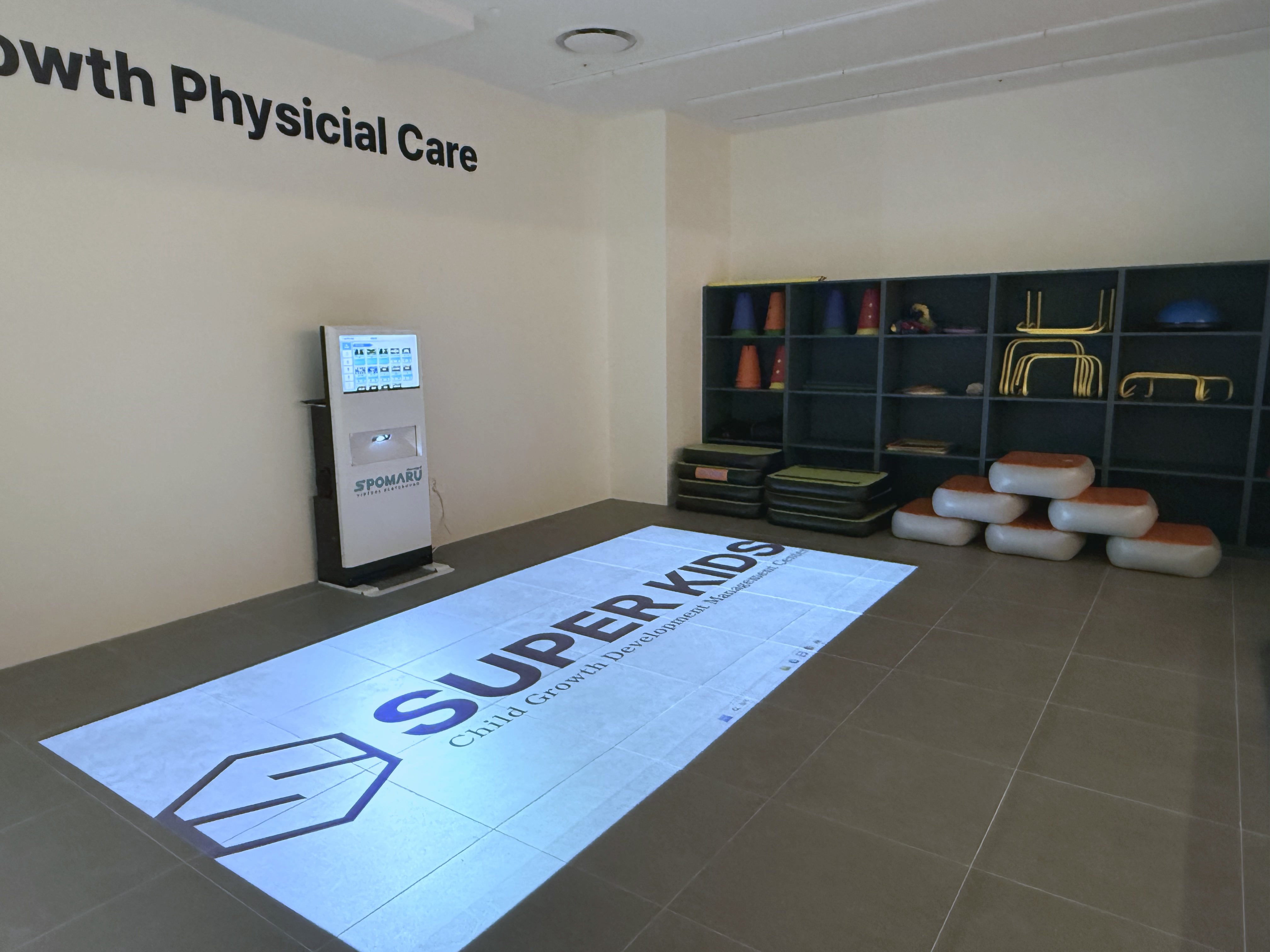 Projected floor activity area inside a SuperKids premium LAB center